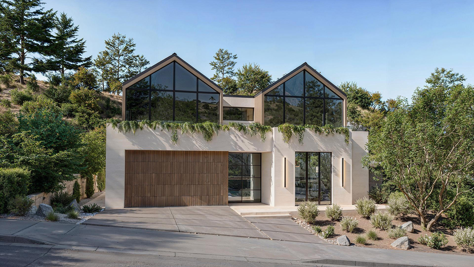 3D render of a contemporary gabled house surrounded by forest